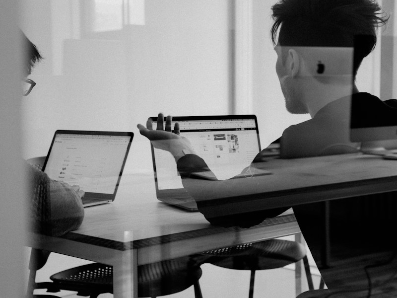 Cleandod editorial team reviewing technical content in a modern office